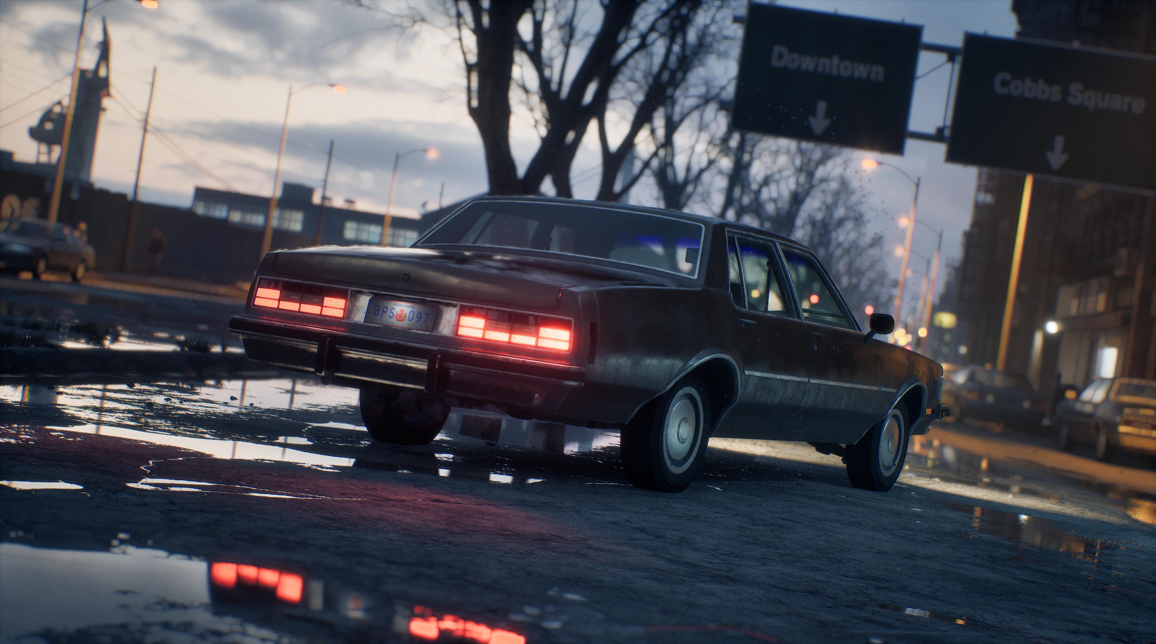 Voiture sous les panneaux Downtown / Cobbs Square